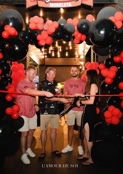 Top Dog Moreleta opening — ribbon cutting celebration